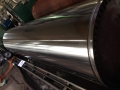 Paper machine roll grinding